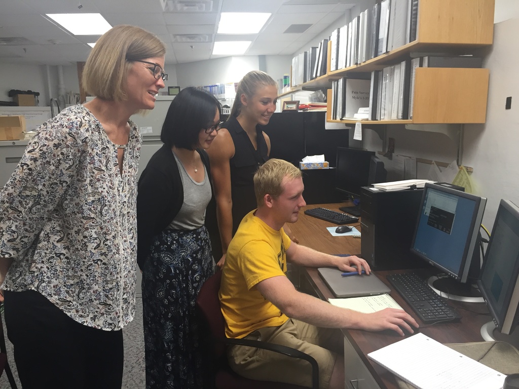 Frey Law Lab looks over results as a team