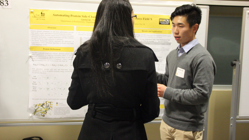 Quowei explains his research through a poster presentation at FURF 2018