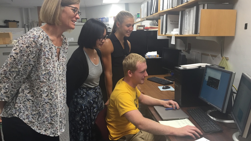 Frey Law Lab looks over results as a team